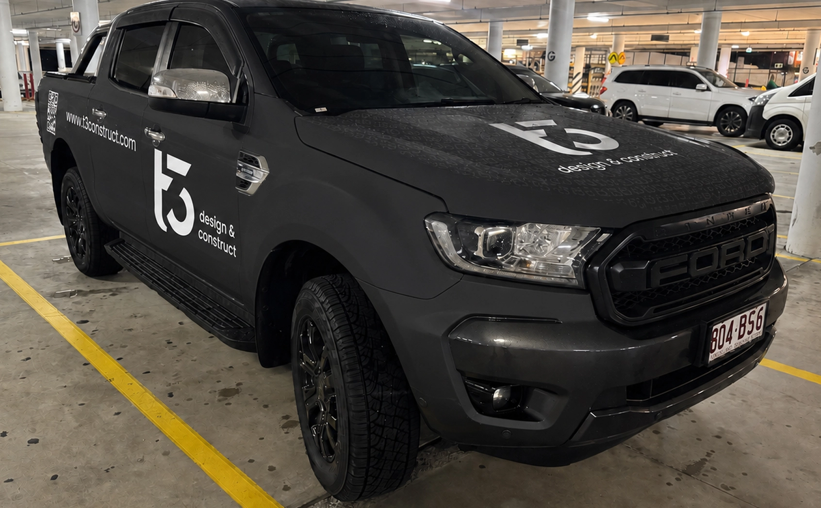 T3 Design & Construct branded Ford Ranger front three-quarter view in a parking garage