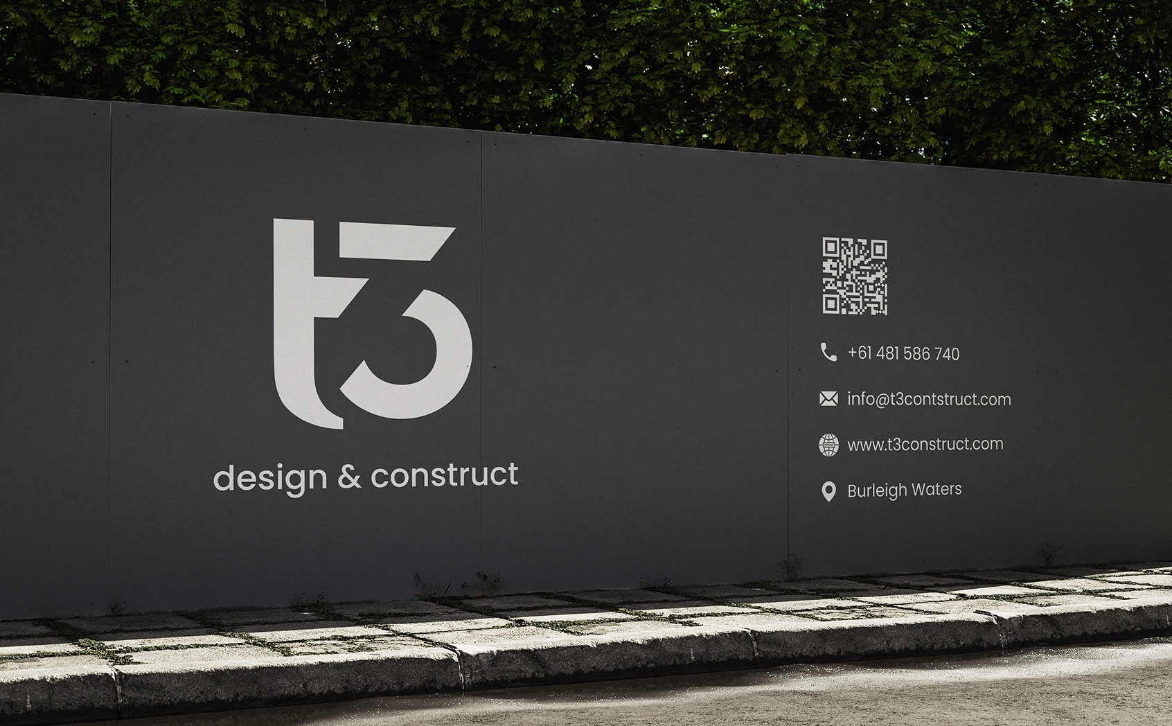 T3 Design & Construct branded hoarding wall with logo, contact details, and QR code